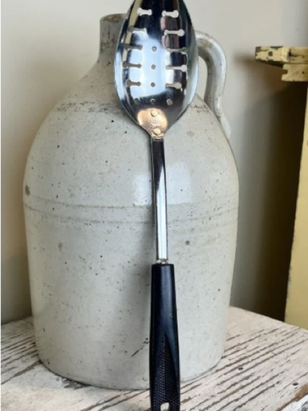 Stainless Steel Slotted Serving Spoon with Black Handle